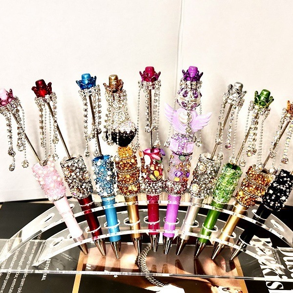 oly-cd70668d34607bc5e9f17eb39d048eee Wholesale DIY heavy industry beaded pen cross-border super fire hand-set diamond creative pen factory