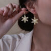 Wholesale Large gold-tone earrings with micro-embellished snowflakes