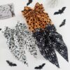 Wholesale New Halloween hair accessories featuring pumpkin skulls, ghost hands, and bows; spring clips for party decorations.