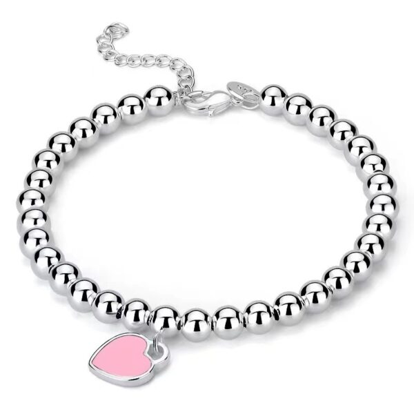 Wholesale brass-plated sier heart bracelet with enamel blue, red, and pink hearts. High-value women's bracelet, opshipping available.