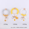 Wholesale New Cartoon sunflower love keychain pendant handmade beaded tassel silicone bracelet wrist keychain