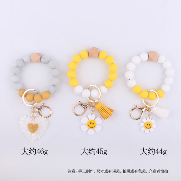 Wholesale New Cartoon sunflower love keychain pendant handmade beaded tassel silicone bracelet wrist keychain