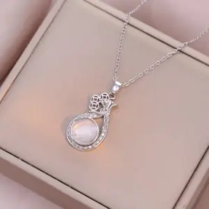 X1694 Steel Color Rotating Purse Necklace