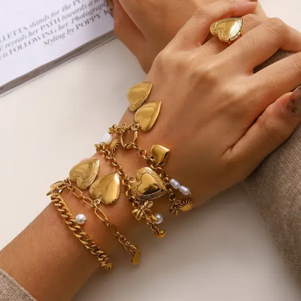 Wholesale 304 Stainless Steel Heart Shape Bow Knot PVD Coated Zircon 18K Real Gold Plated Real Gold Plated Simple Style Classic Style Waterproof Non Tarnish Pearl Inlay Cuban Link Chain Curb Chain Paperclip Chain Belcher Chain Multi Charms Bracelet