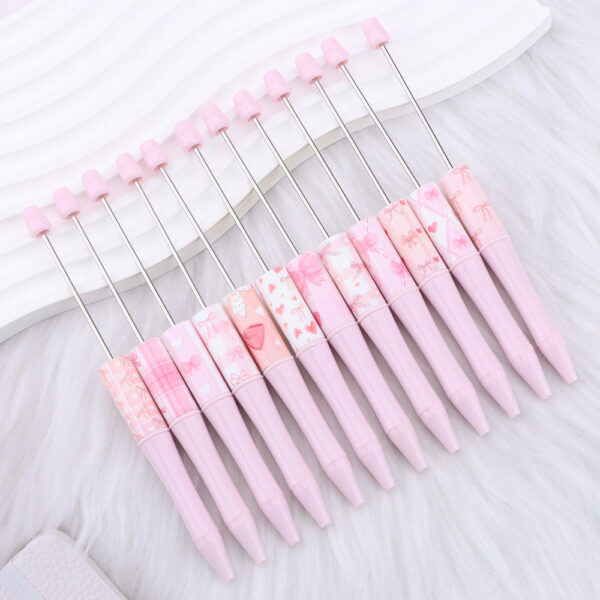 Wholesale New DIY pink bow-print beaded pen, perfect for a girly look.