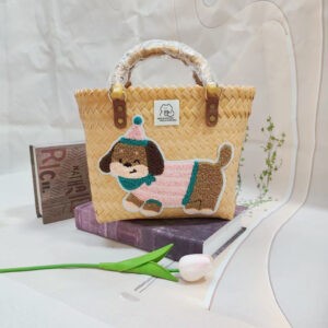 Beige bamboo handle basket with pink striped dog