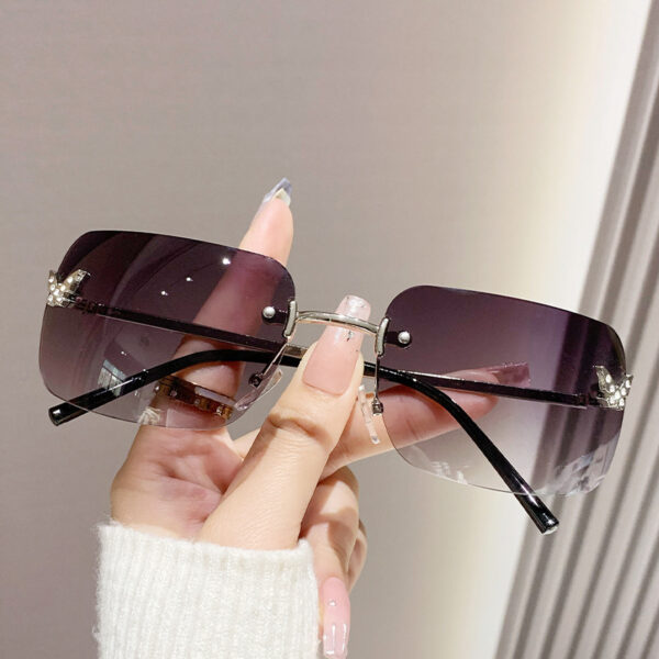 oly-d6b610a3baee44fd2ce044d2543a334e Wholesale frameless sunglasses sunscreen glasses fashion high sense butterfly aessories diamond sunglasses ladies