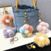 Wholesale Cherry blossom fur ball car keychain small fresh colorful plush small flower mobile phone ornaments flower bag pendant gift