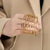 Wholesale Ion Plating (IP) 18K Gold Plated Curve 304 Stainless Steel Simple Style Waterproof Non Tarnish 304 Stainless Steel Bangle