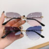 oly-d8ff7386e308b6f71c3d6150922a3852 Wholesale Cross-border in stock new frameless trim sunglasses fashion cat's eye gradient sunglasses Europe and the United States retro Internet red explosions