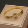 Wholesale PVD Coated 18K Gold Real Gold Plated Tree Leaves Eye Stainless Steel Casual Waterproof Non Tarnish Bangle