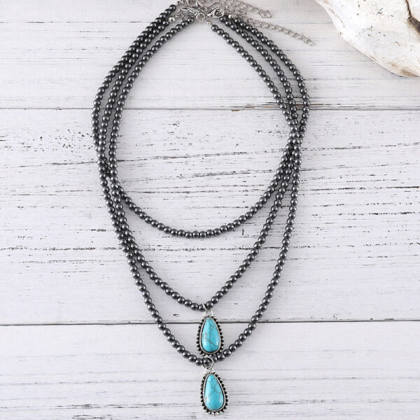 Wholesale European and American cross-border Bohemian ethnic style three-layer teardrop-shaped turquoise black bead necklace, popular jewelry