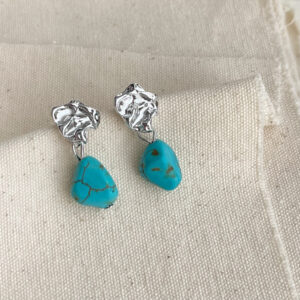 Synthetic turquoise liquid metal