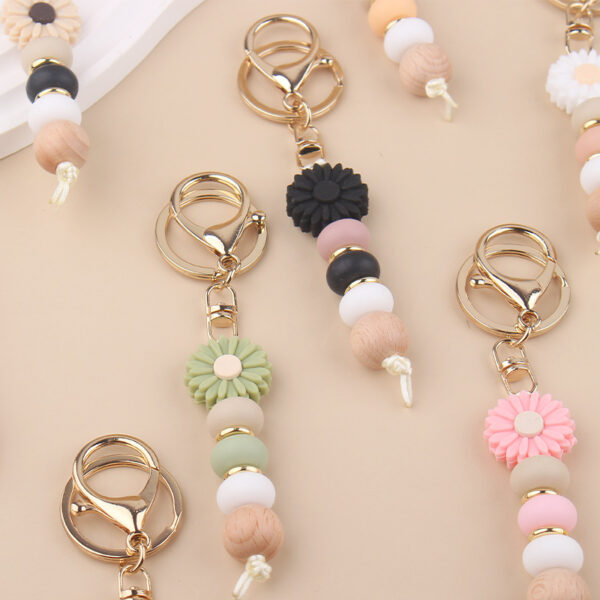 Wholesale New creative DIY cartoon daisy small tooth glue pendant handmade silicone beaded bag pendant keychain