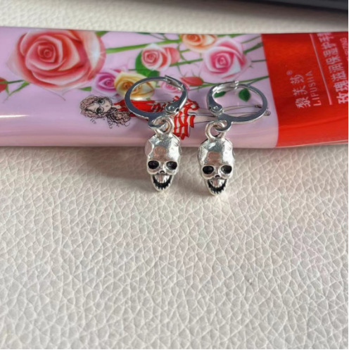 oly-db9f4cc533df24c867072009c33bbe2a Wholesale temu best selling skull ear buckle fashion personalized retro earrings niche punk internet celebrity earrings