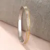 Wholesale Elegant XUPING Simple Style Color Block 304 Stainless Steel 18K Gold Plated Raw Steel Bangle In Bulk