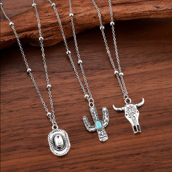 Wholesale Europe and the United States cross-border western Denim retro ethnic style imitation turquoise alloy cow's head war boots hat pendant necklace