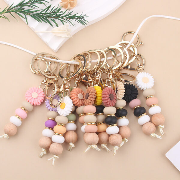 Wholesale New creative DIY cartoon daisy small tooth glue pendant handmade silicone beaded bag pendant keychain
