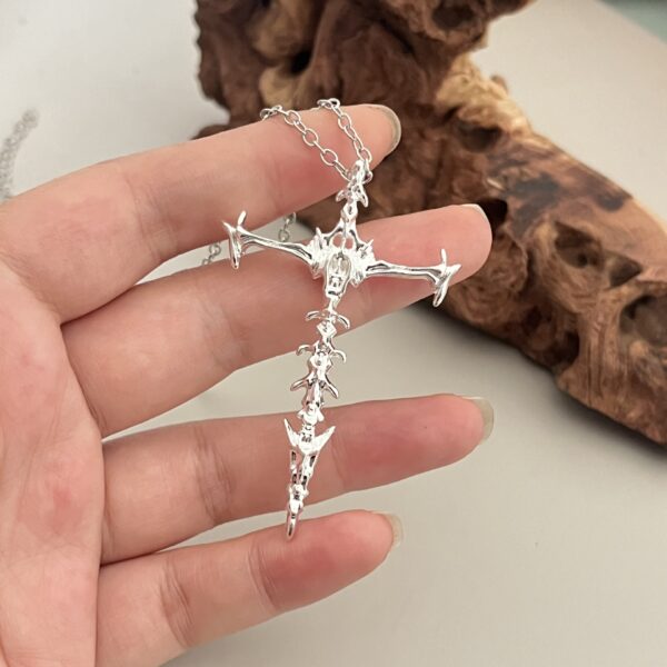 oly-e5c3ffc49bfec6690bbe4c2da6c44085 Wholesale Personalized Chiropractic Cross Necklace Couple's Hollow Retro Bones Dark Pendant Stereo Double-Sided Punk Necklace