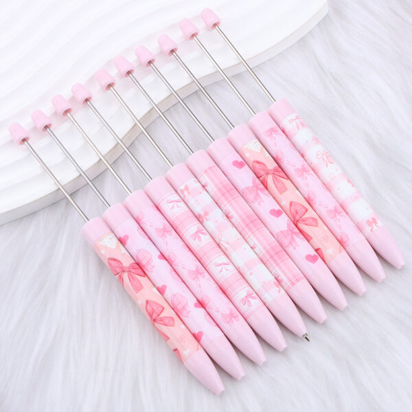 oly-e6540480398c1cf8d7c913ff8b83c567 Wholesale DIY long printed beaded pen with pink bow pattern