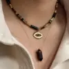 Wholesale 304 Stainless Steel Natural Stone Titanium Steel 14K Gold Plated Retro Ethnic Style Classic Style Plating Geometric Round Eye Rings Necklace