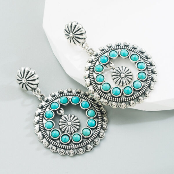 oly-e90167d7b109f5c0bbdc2b329af0a694 Wholesale white turquoise earrings hollow round pendant exaerated party earrings