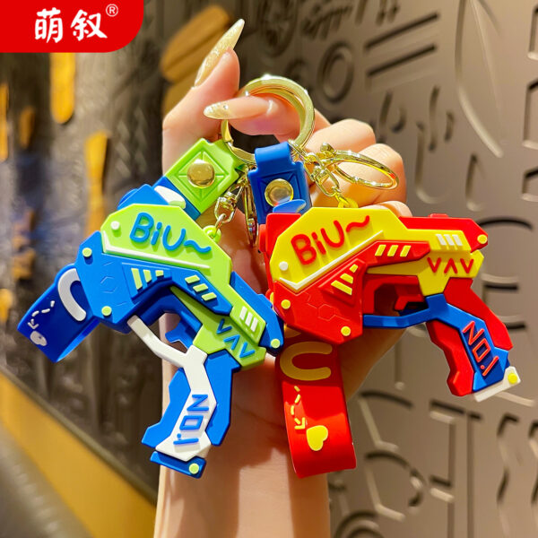 Wholesale Cool pistol cartoon keychain creative doll couple bag pendant exquisite car key chain ornaments
