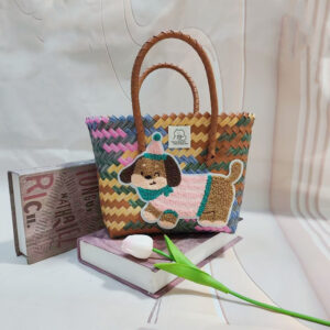 Gray color hand basket with pink striped dog