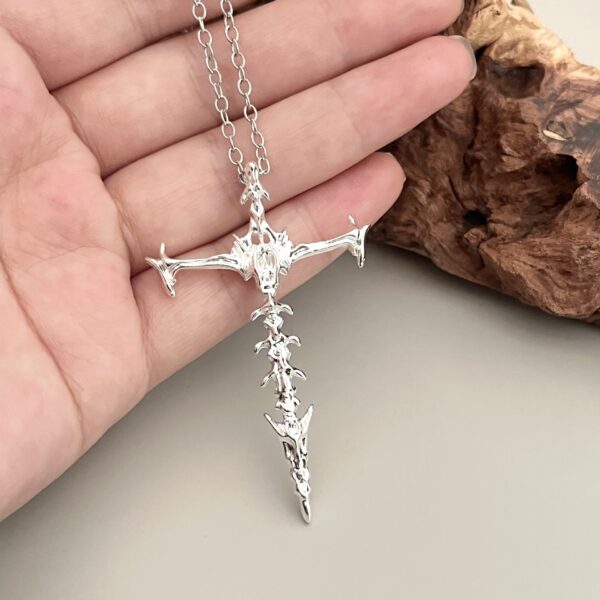oly-f19f11e694c65e38312368f6f20784a0 Wholesale Personalized Chiropractic Cross Necklace Couple's Hollow Retro Bones Dark Pendant Stereo Double-Sided Punk Necklace
