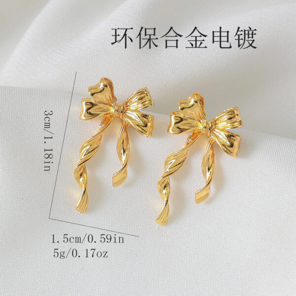 oly-f23566ac6a540a342d211135bdada50b Wholesale European and American Cross-Border Hot-Selling Environmentally Friendly Alloy Gold Bow Personalized Fashion Trend Earrings Earrings Design Niche