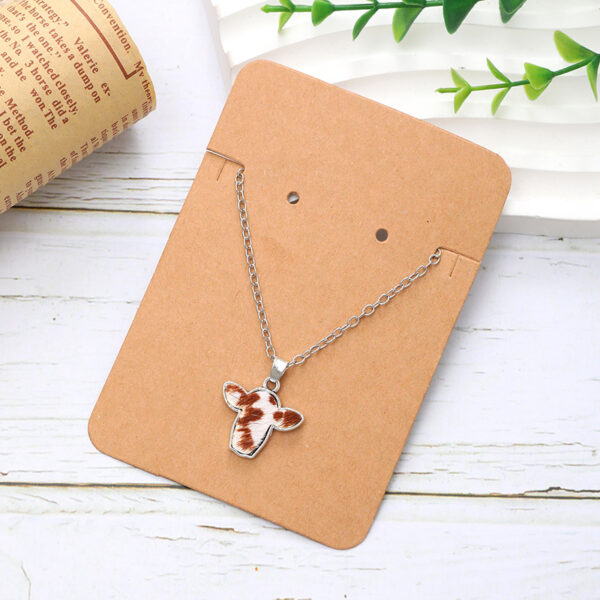 Wholesale Western style alloy mini cow head random pattern pendant simple fashion ladies jewelry necklace