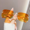 oly-f2a72550ef76f3a1c7c64f30efa37c78 Wholesale frameless sunglasses sunscreen glasses fashion high sense butterfly aessories diamond sunglasses ladies