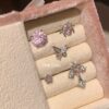 oly-f36f7732d97b81d7ac7b72680fabd0f4 Wholesale Pink zircon cross ear bone nail titanium steel screw fireworks cut ear nail niche design butterfly earrings
