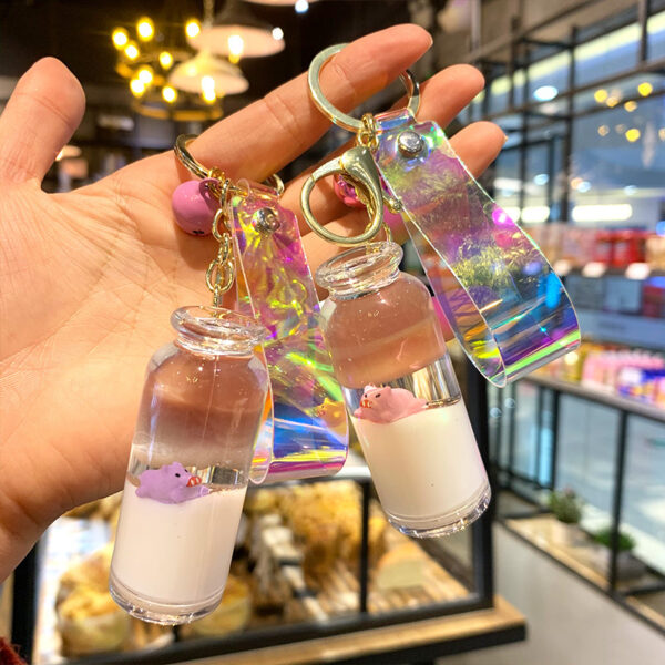 Wholesale Creative Internet red floating pig milk pig keychain cartoon quicksand oil drift bottle car bag pendant