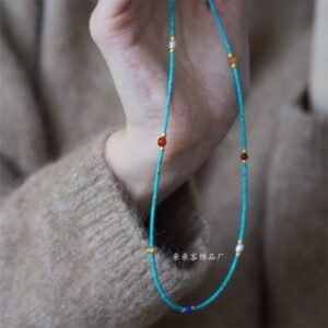 Blue beaded pearl necklace