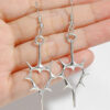 oly-f6cd73b8899c25b0aeb62293e467c666 Wholesale Hollow spiny heart earrings Y2K punk hollow spiny heart headphones