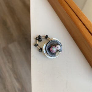 L black button purple round stone