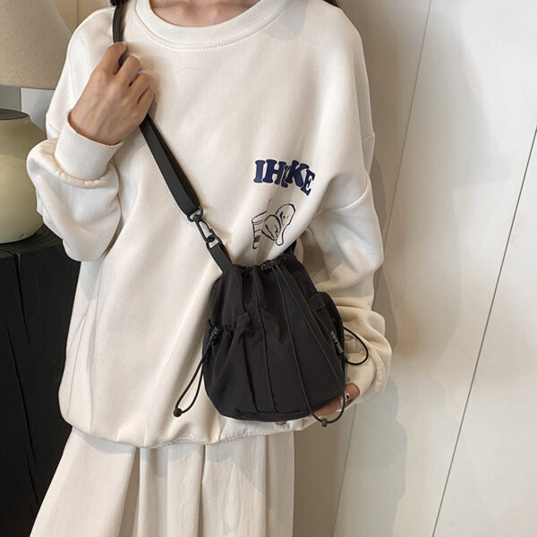 oly-fb97da3d412376655a21b1b153e88452 Wholesale Japanese Style Ins Niche Design awstring Bucket Outdoor Srts Casual Fashion All-match Nylon Crossbody Bag