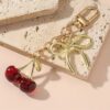 Wholesale European and American Jewelry Simulation Crystal Cherry Keychain Bag Hanging Bow Pendant Design Sense Fruit Key Chain