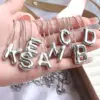 Wholesale Simple Style Classic Style Letter Copper Silver Plated Pendant Necklace In Bulk