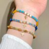 oly-fd00e8d97fcaaf999bbcbd5b239ff8bf Wholesale Cross-border colored gemstone beaded cross bracelet for women, bohemian style, woven drawstring bracelet, jewelry wholesale.
