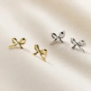 Wholesale 1 Pair Simple Style Bow Knot Plating Copper Ear Studs