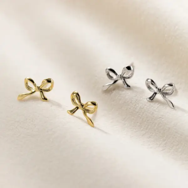 Wholesale 1 Pair Simple Style Bow Knot Plating Copper Ear Studs