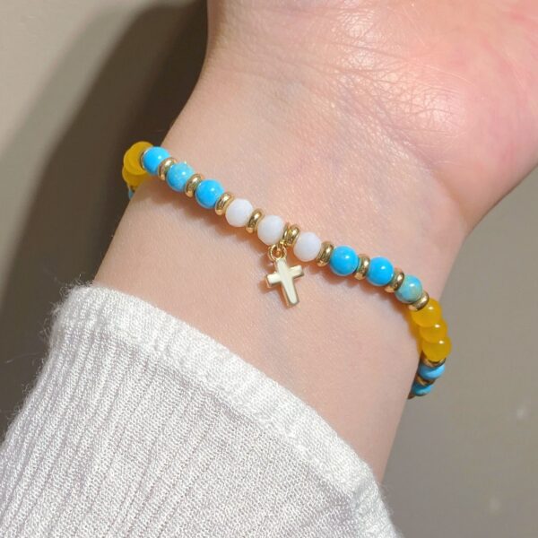 oly-feab04210fbd74e0cd8faa8e19e7f6d4 Wholesale Cross-border colored gemstone beaded cross bracelet for women, bohemian style, woven drawstring bracelet, jewelry wholesale.