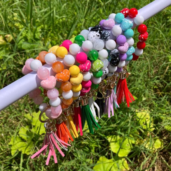 oly-ff8a12c0f59a01655e3f0db2be44bfb1 Wholesale Colorful beaded heart-shaped printed tassel bracelet/keychain