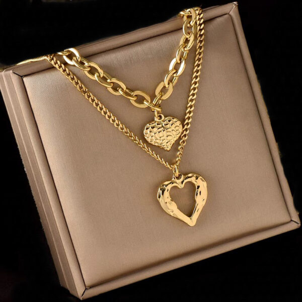 oly-0449f69b059504ec08f3b03de1230cc0 Wholesale retro fashion high-end simple multi-layer titanium steel metal chain texture hollow heart pendant necklace
