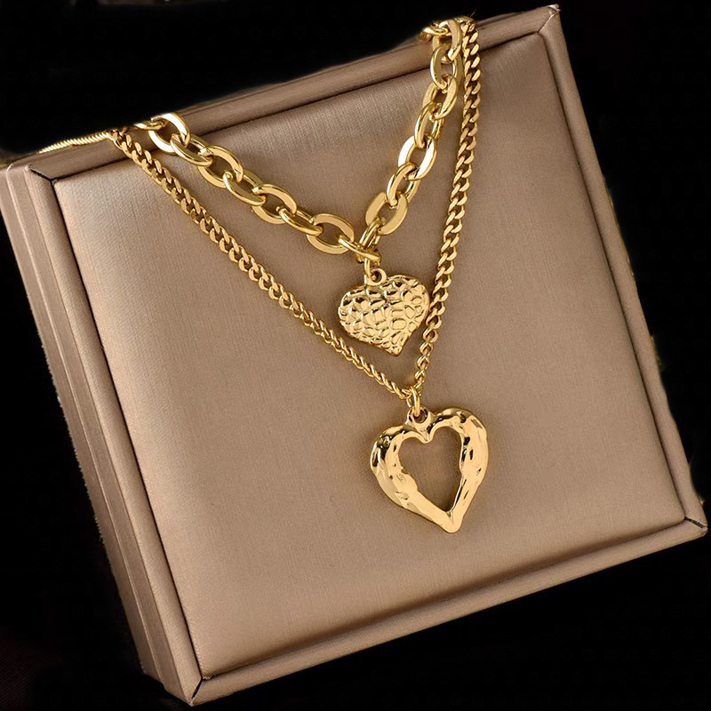 Wholesale European and American cross-border retro fashion high-end simple multi-layer titanium steel metal chain texture hollow heart pendant necklac