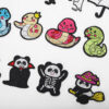 oly-044f1aec00ae2ddc542333777b2970f2 Wholesale Elegant Embroidery Product Computer Embroidery Sticker Small Snake Cloth Sticker Original Black Cat Patch Sticker Magic Panda Bag Decorative Decal