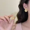 Wholesale Sunflower Stud Earrings For Women In Dyed Black Copper With Real Gold Plated Finish