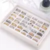 Wholesale Unisex Geometric Rings In Titanium Steel With PVD Coated Gold Plating And Rhinestone Inlay Featuring Cutting Craft